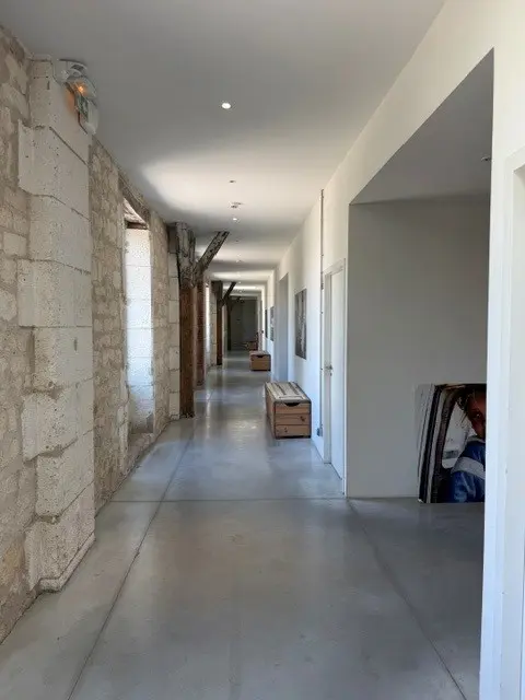 Stone corridor inside Darwin Éco-système Bordeaux, French in Bordeaux training location