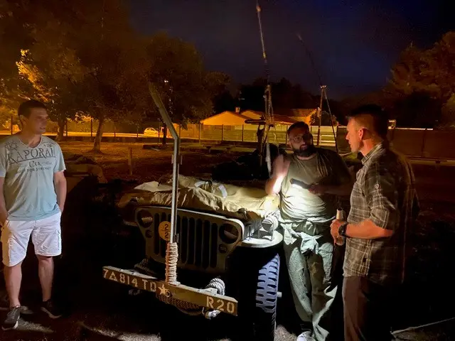 Living-history reconstruction with a wartime jeep near Bordeaux