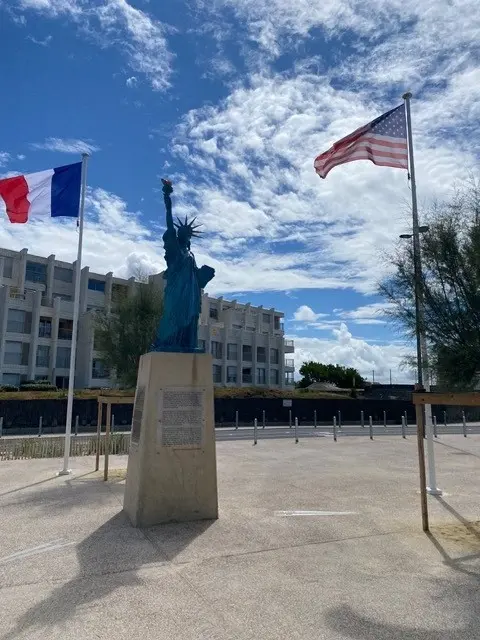 A Statue of Liberty with French and American flags near Bordeaux, France